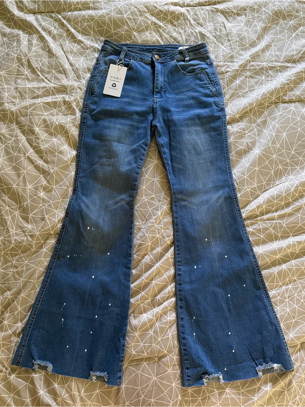 High-Rise Blue Flare Jeans with Distressed Hem